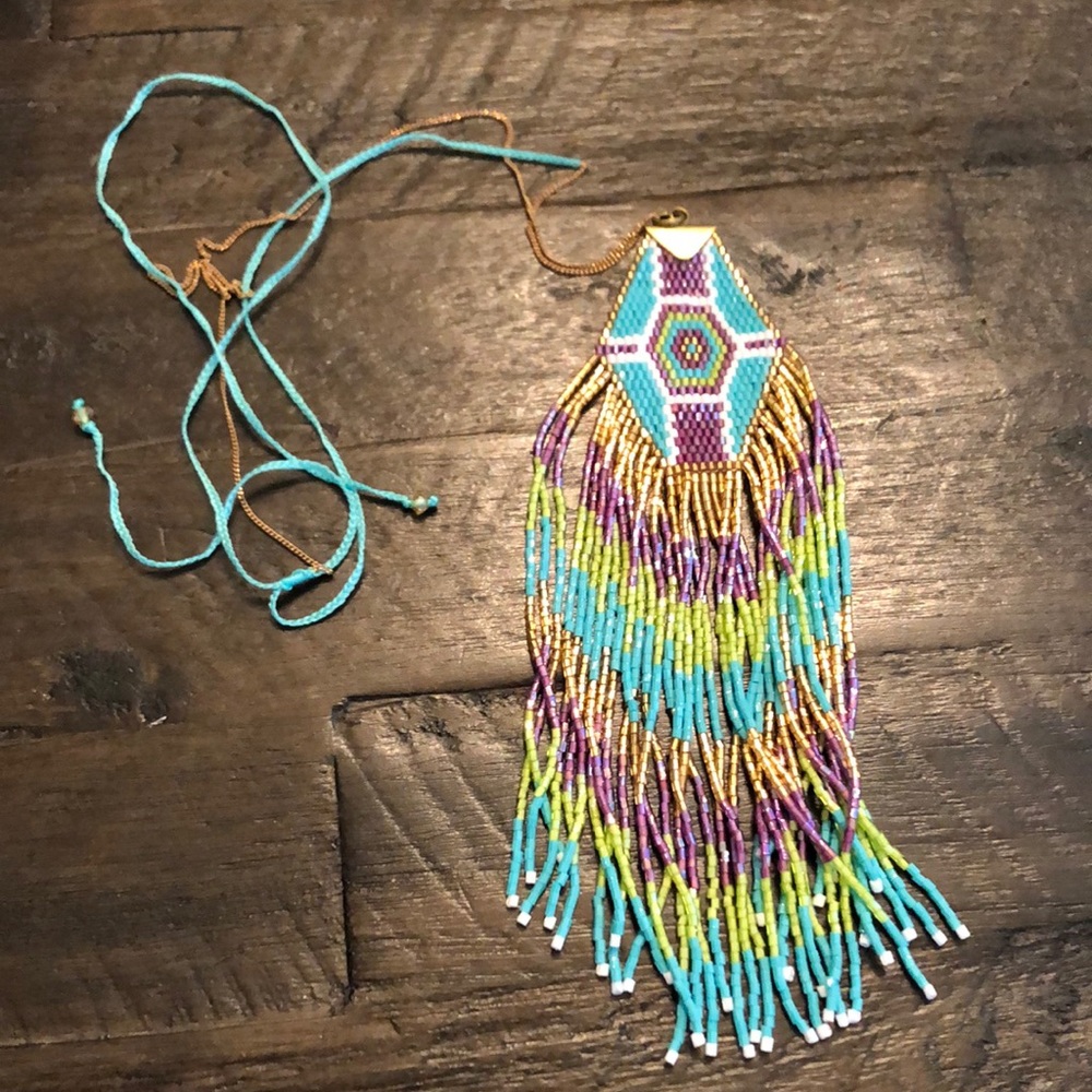 Necklace with Native American inspired design. Finest beaded work w/ silk string
